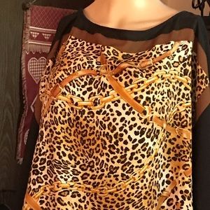 A poncho type silk animal print top in 1X.